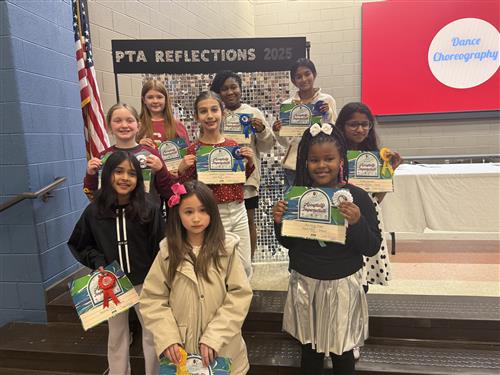 9 student winners in Dance Choreography standing with awards